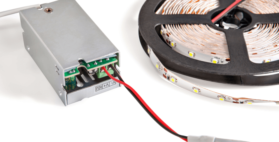 A grey power supply connected to a strip light. 