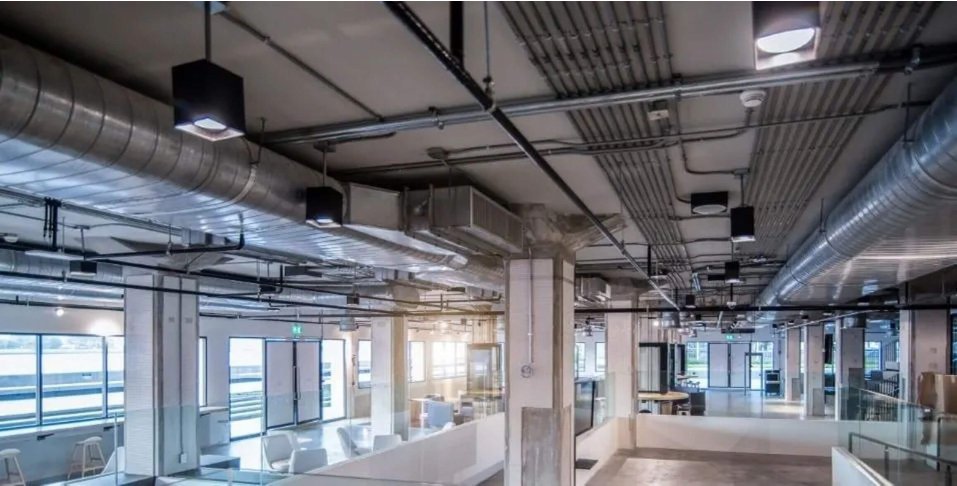 industrial style indoor office space with lights on